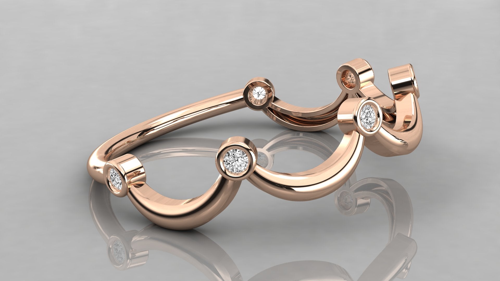 A side perspective of the Cloudia rose gold ring lying on a surface, showing its fluid cloud-like silhouette.