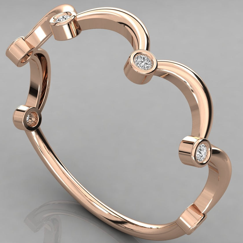 A perspective angled view of the Cloudia 14k rose gold wavy ring with six bezel-set diamonds.