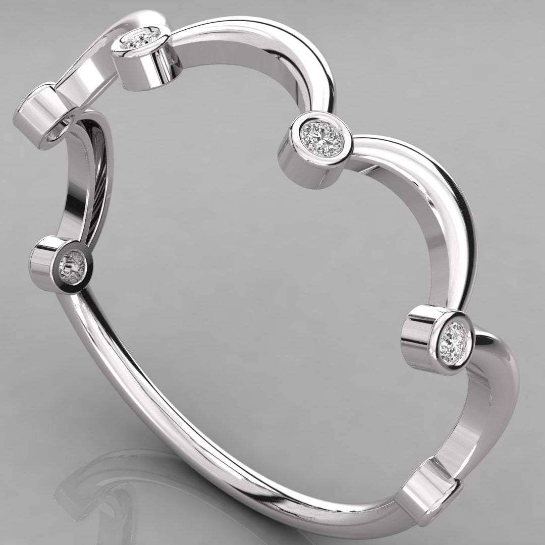 Three-quarter perspective of the Cloudia white gold ring, highlighting the sculptural wave design and bezel settings.