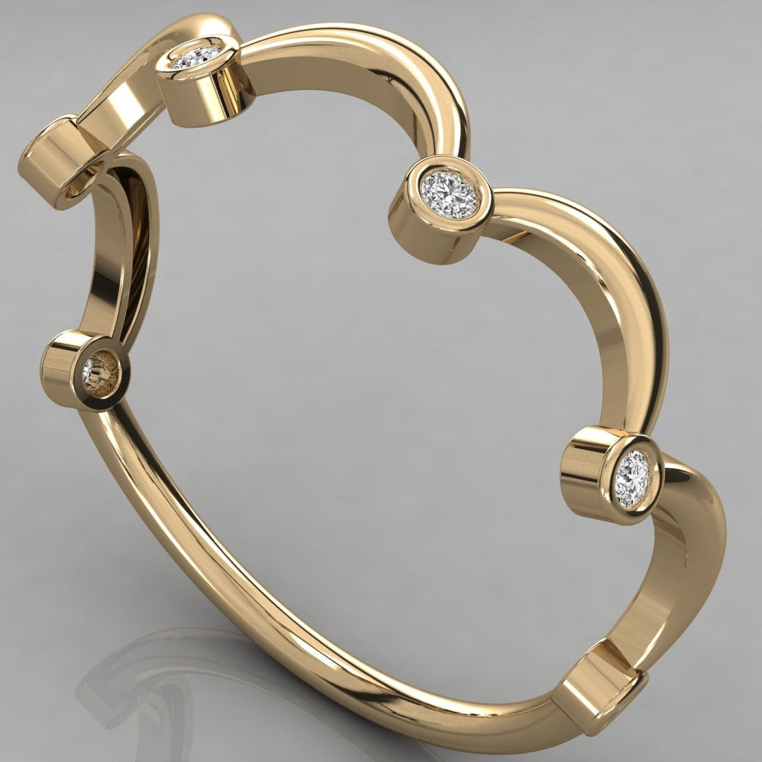 An angled perspective view of the Cloudia 14k yellow gold ring, with six stones set along the wavy silhouette.