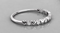 Horizontal flat lay view of the 585 white gold Juliette heart eternity band with sparkling lab-created diamonds.