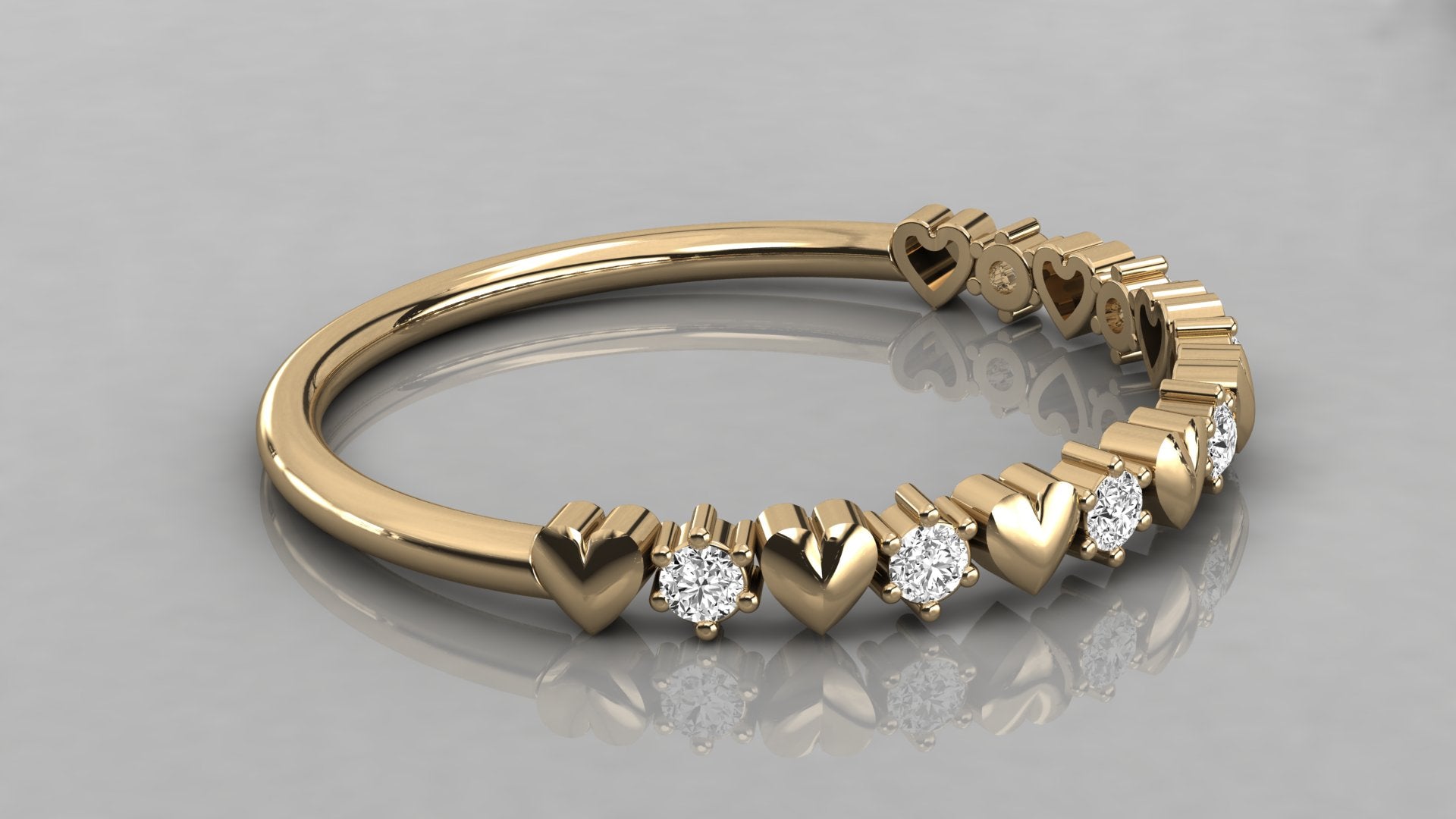 Professional flat lay shot of the Juliette 14k yellow gold heart ring, highlighting the craftsmanship and ethical diamonds.