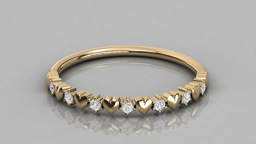 Detailed perspective low-angle view of the Juliette yellow gold heart ring, showcasing the high-polish finish and sparkling lab diamonds.