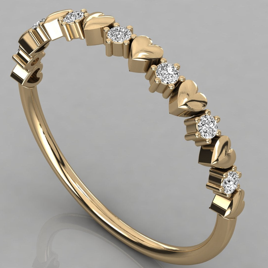 Perspective view of the Juliette heart ring in solid 14k yellow gold with a delicate row of sparkling ethical lab-grown diamonds.
