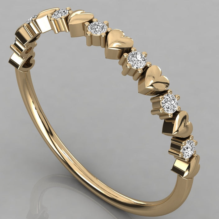 Perspective view of the Juliette heart ring in solid 14k yellow gold with a delicate row of sparkling ethical lab-grown diamonds.