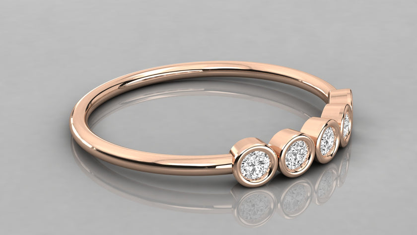 Side perspective of the Luna rose gold 585 minimalist band lying down, showcasing five ethical lab-created diamonds.