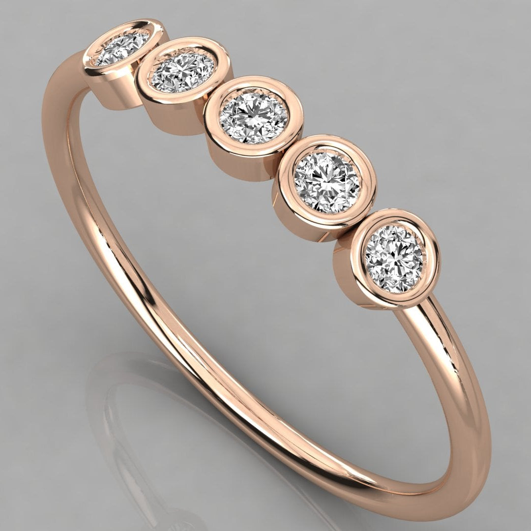 Perspective angled view of the Luna 14k rose gold stackable ring featuring five 2.0mm lab-grown diamonds in a minimalist bezel setting.
