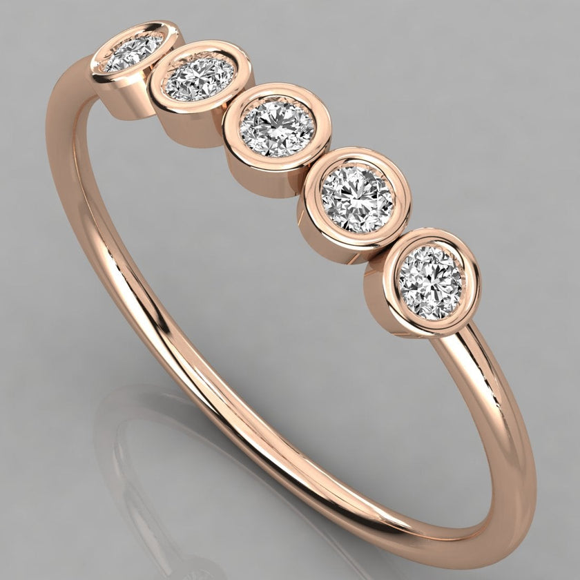Perspective angled view of the Luna 14k rose gold stackable ring featuring five 2.0mm lab-grown diamonds in a minimalist bezel setting.
