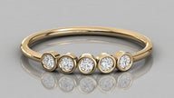 Front-on view of the Luna 14k yellow gold ring showcasing the radiant row of five lab-grown diamonds in a classic band.