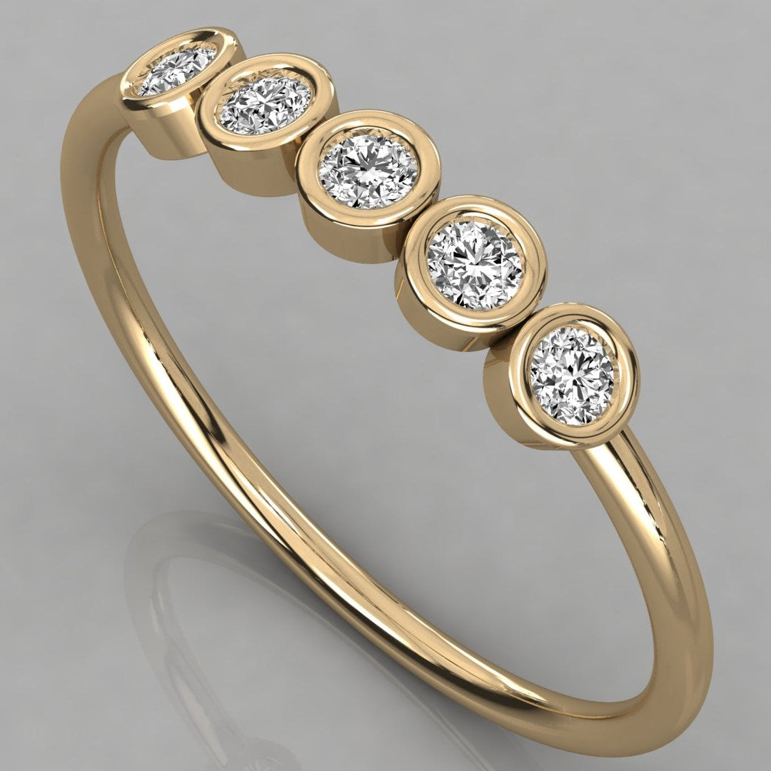 Perspective shot of the Luna 14k yellow gold minimalist ring with 5 sparkling 2.0mm diamonds in an eternity-style setting.