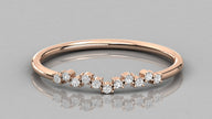 Direct frontal view of the Lyra 14k rose gold wishbone ring focusing on the symmetrical row of eleven lab-grown diamonds.