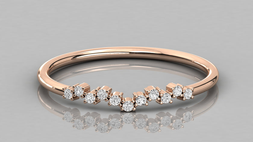 Direct frontal view of the Lyra 14k rose gold wishbone ring focusing on the symmetrical row of eleven lab-grown diamonds.