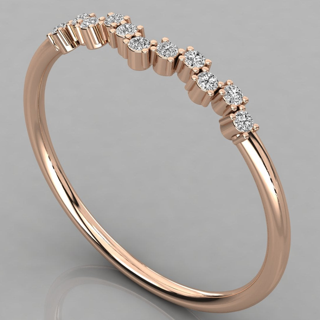 A perspective view of the Lyra 14k rose gold chevron ring featuring eleven 1.2mm lab-grown diamonds in a delicate wishbone design.