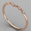 A perspective view of the Lyra 14k rose gold chevron ring featuring eleven 1.2mm lab-grown diamonds in a delicate wishbone design.
