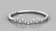 Frontal shot of the Lyra white gold chevron band showcasing the brilliance of eleven ethical 1.2mm diamonds.