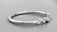 Lying perspective of the Lyra 585 white gold chevron ring, emphasizing the clean minimalist lines and ethical stones.