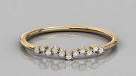 Close-up front view of the Lyra yellow gold stackable ring, highlighting the elegant V-shape and diamond setting.