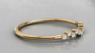 Horizontal view of the Lyra yellow gold chevron ring lying down, showcasing the rich gold glow and eleven diamonds.