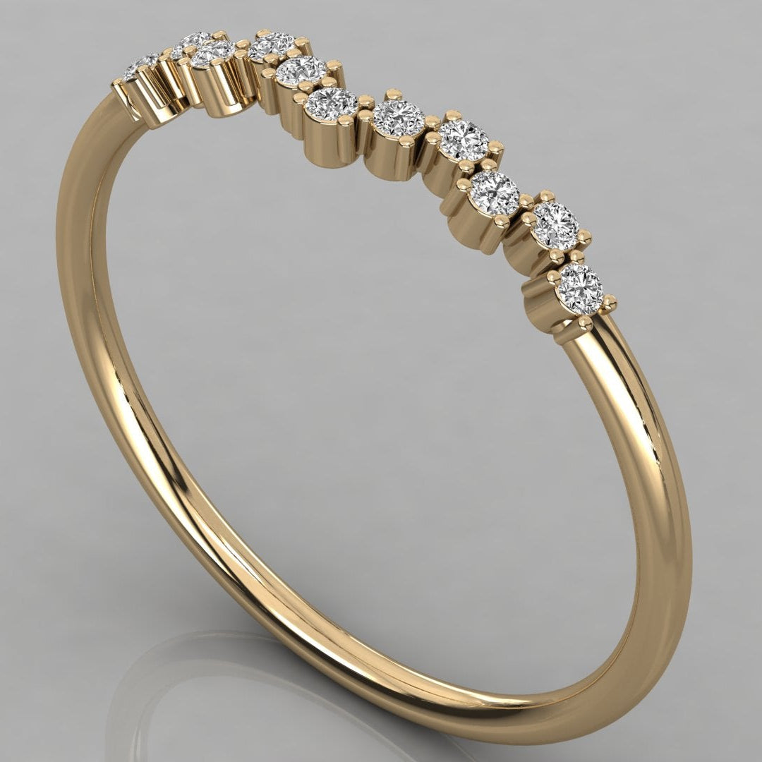 An angled perspective shot of the Lyra 14k yellow gold wishbone ring featuring a radiant row of lab-grown diamonds.