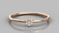 Direct frontal shot of the Mira 14k rose gold ring focusing on the seven lab diamonds in a botanical flower setting.