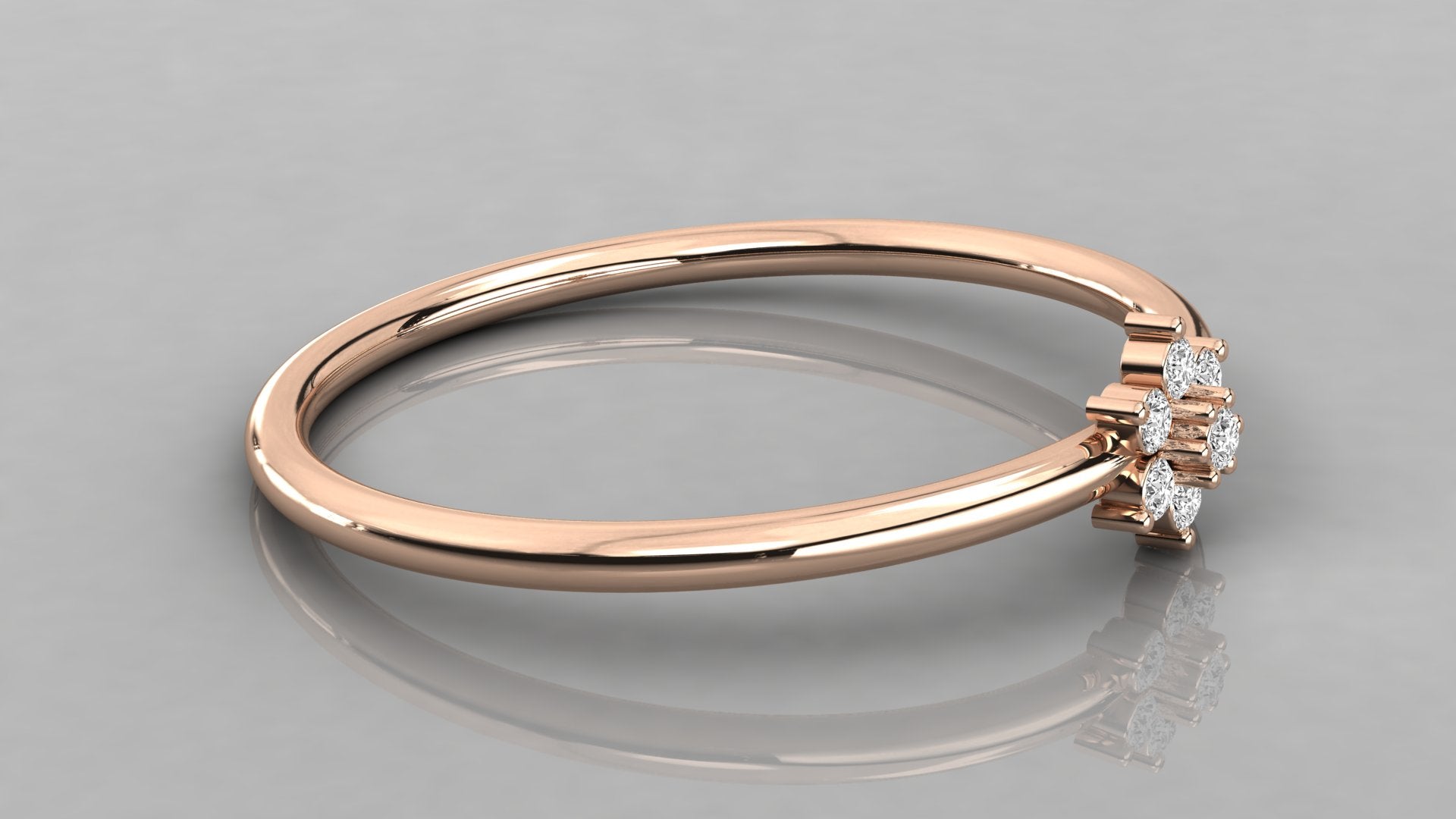Side-angle view of the Mira rose gold stackable ring lying down, showing the delicate flower petal motif.
