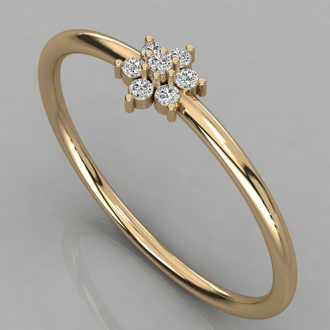 Perspective view of the Mira 14k yellow gold ring where diamonds form a radiant golden flower cluster.