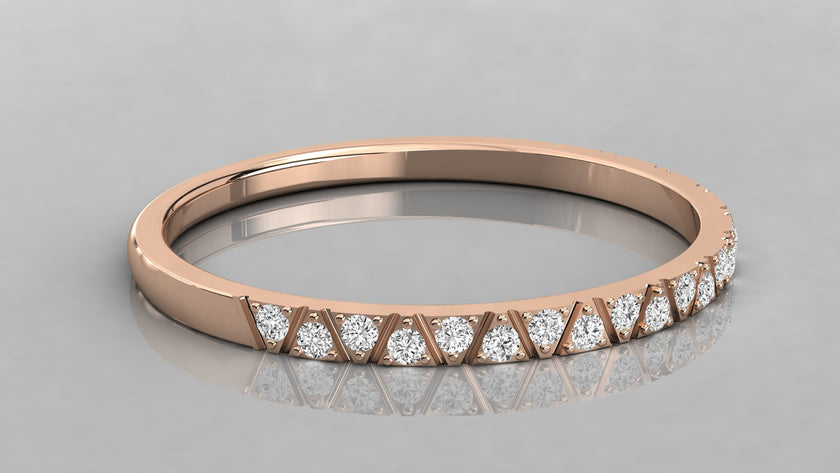 Side perspective of the Nova rose gold stackable band highlighting the ethical stones.