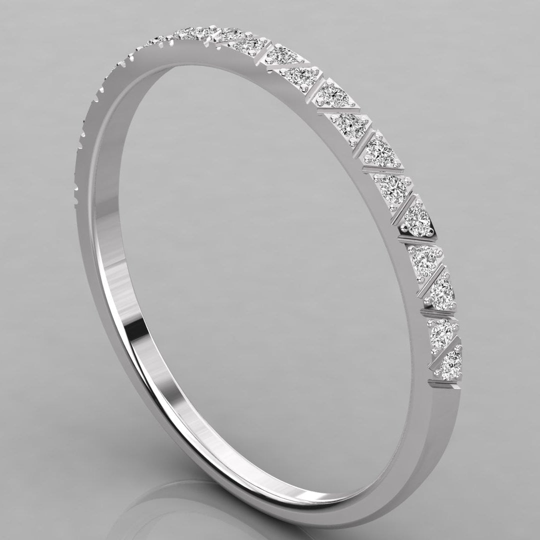 Three-quarter view of the Nova white gold eternity ring with brilliant-cut diamonds.