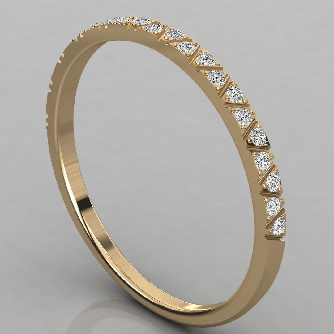Angled perspective of Nova 14k yellow gold eternity ring with a continuous stone row.