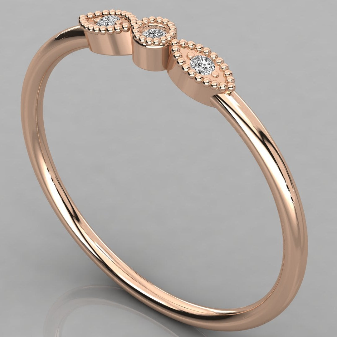 A detailed close-up of the Selene 14K rose gold vintage ring with three lab-grown diamonds in a milgrain setting.