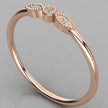A detailed close-up of the Selene 14K rose gold vintage ring with three lab-grown diamonds in a milgrain setting.