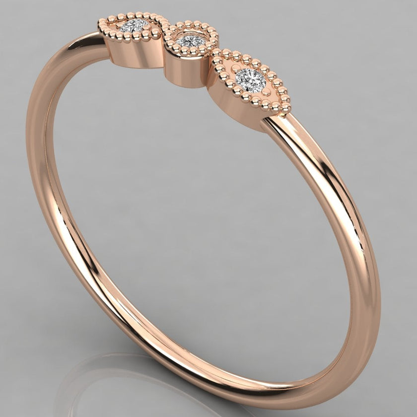 A detailed close-up of the Selene 14K rose gold vintage ring with three lab-grown diamonds in a milgrain setting.