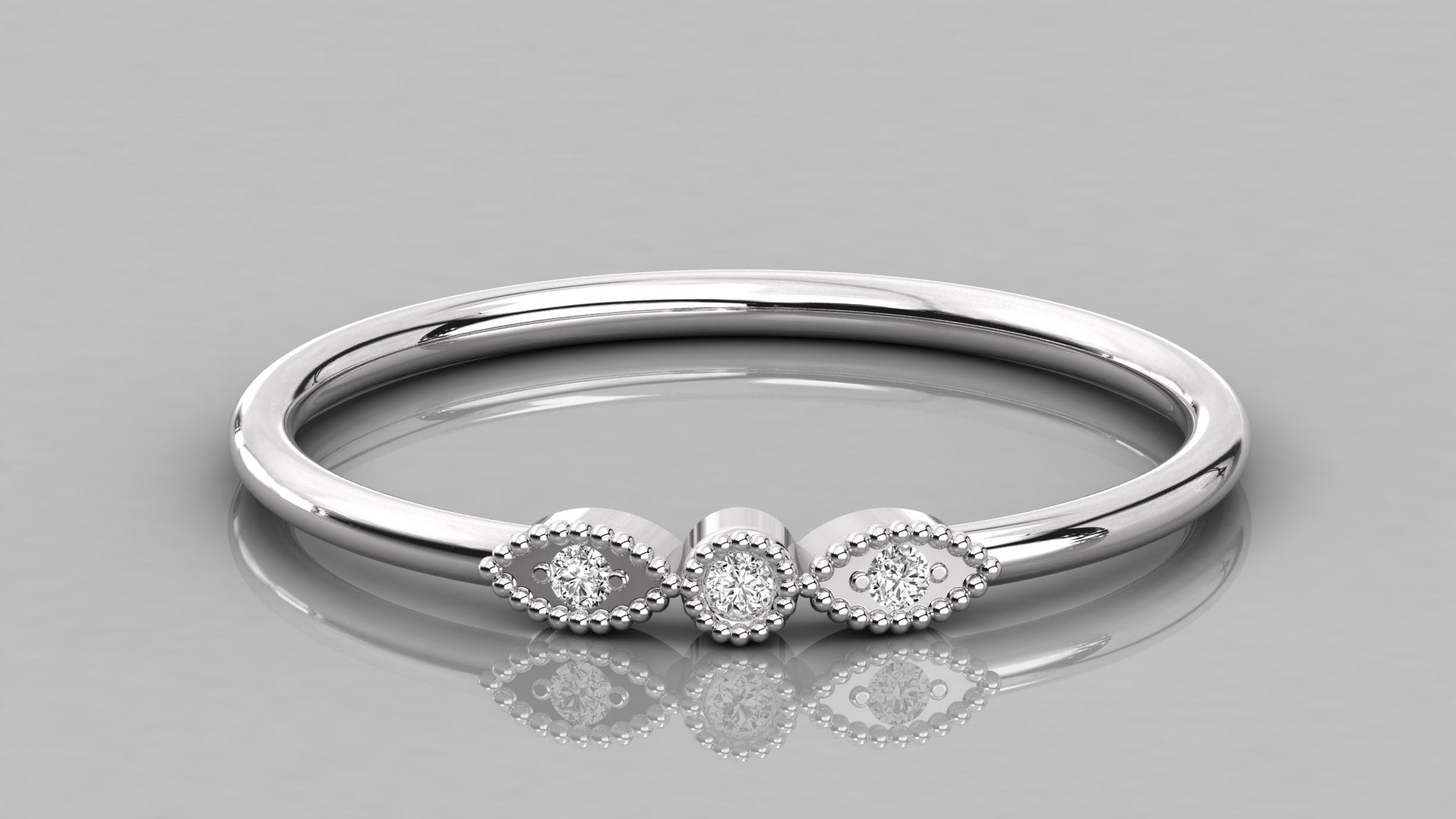 Professional overhead view of the Selene 14K white gold ring, emphasizing the brilliant sparkle of the sustainable three-stone design.