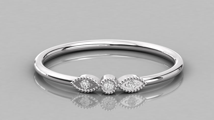 Professional overhead view of the Selene 14K white gold ring, emphasizing the brilliant sparkle of the sustainable three-stone design.