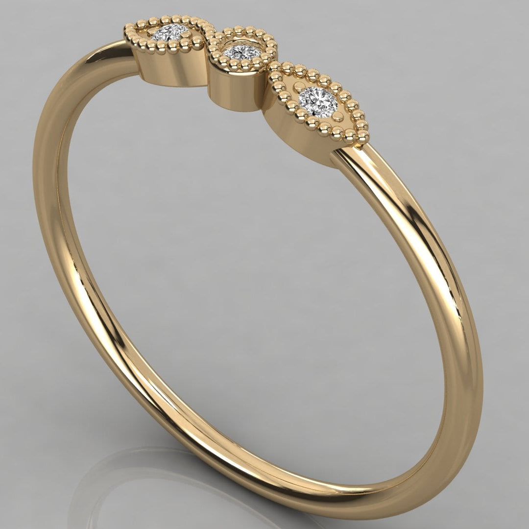 An angled perspective shot of the Selene 14K yellow gold vintage ring featuring radiant lab-grown diamonds in a classic vintage style.