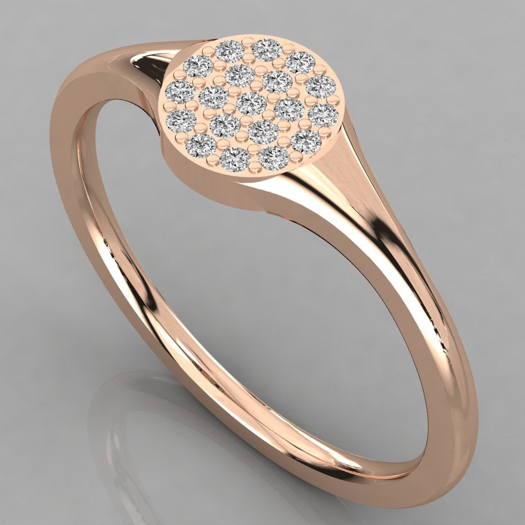 An angled perspective view of the Stella 14K rose gold modern signet ring featuring a cluster of 19 sparkling lab-grown diamonds.