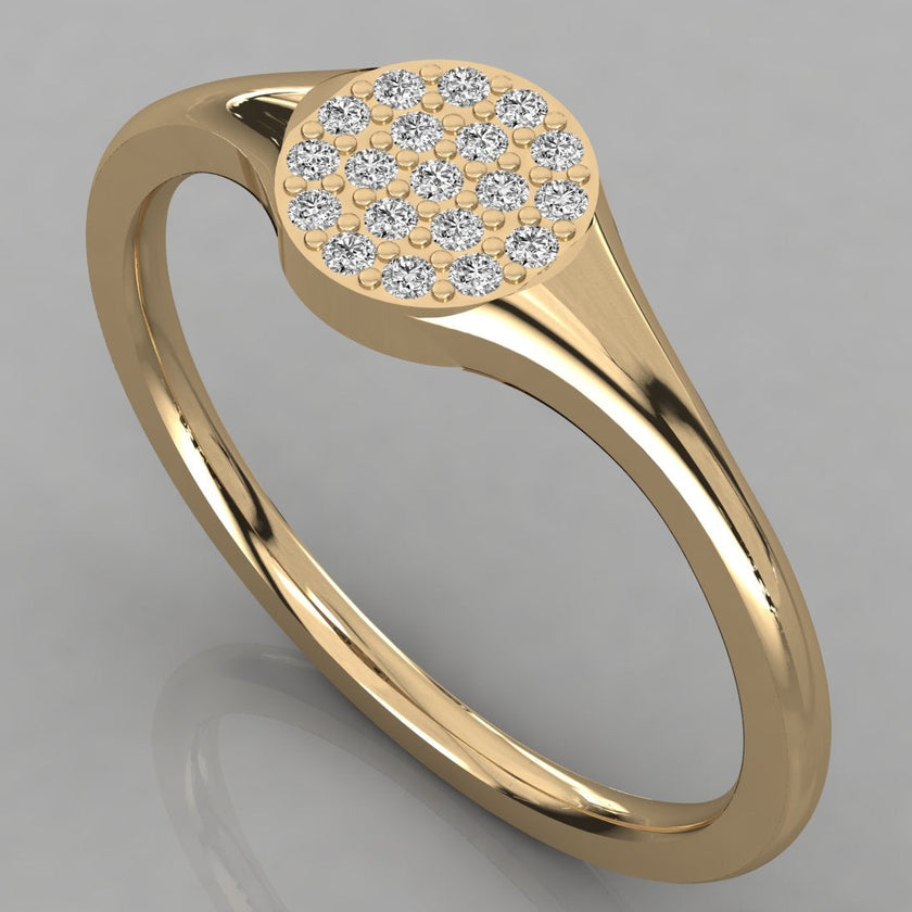 An angled perspective of the Stella 14K yellow gold signet ring featuring a radiant cluster of 19 sustainable lab-grown diamonds.