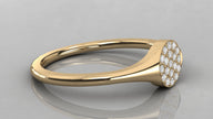 Horizontal view of the Stella yellow gold signet ring lying down, showcasing the rich gold glow and low-profile diamond setting.